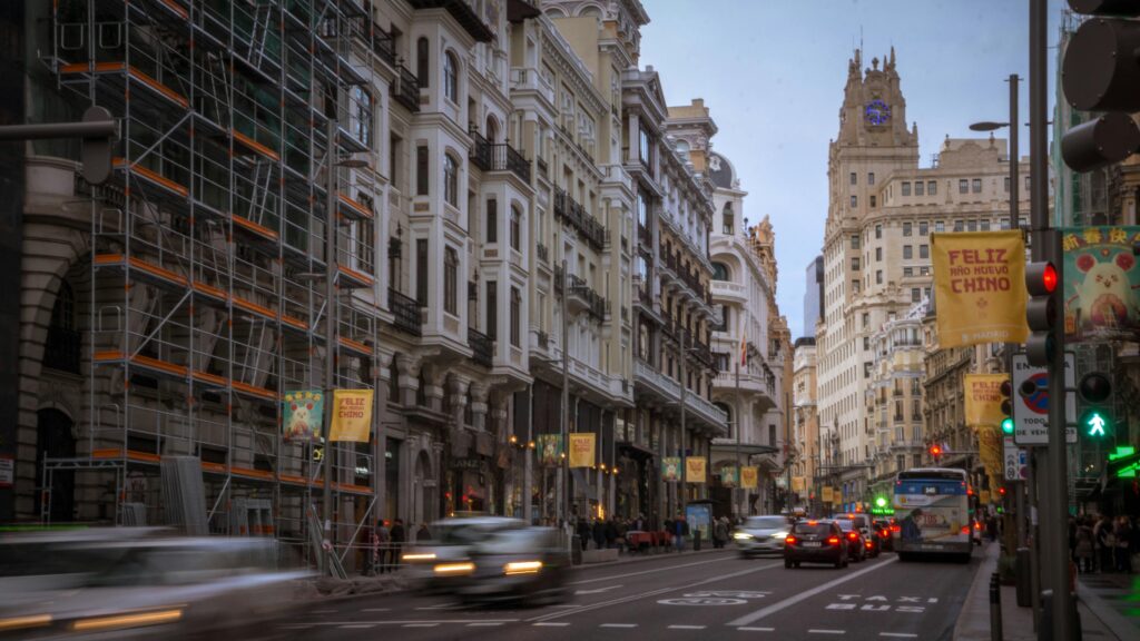 View of Gran Via street in Madrid featuring iconic Telefonica Building and urban scenery.