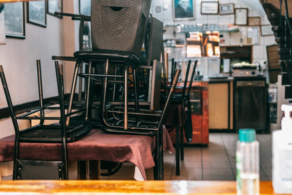 Empty café interior in Istanbul with stacked chairs, reflecting cleanliness and organization.
