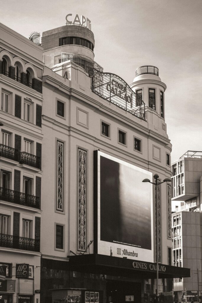 Vintage view of the iconic Cine Capitol building in Madrid's Gran Via, Spain.